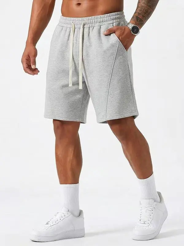 Men's Casual Cotton Shorts Ideal for Workouts, Jogging, and Everyday Lounging at Home. Soft against the Skin with Moisture-Wicking Properties. Features a High-Stretch Drawstring Waistband for Adjustable Fit. Relaxed Straight-Leg Silhouette